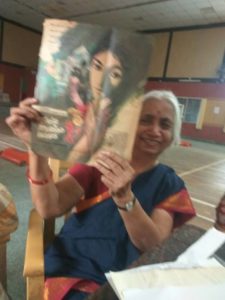 Sakuntala holds up a magazine